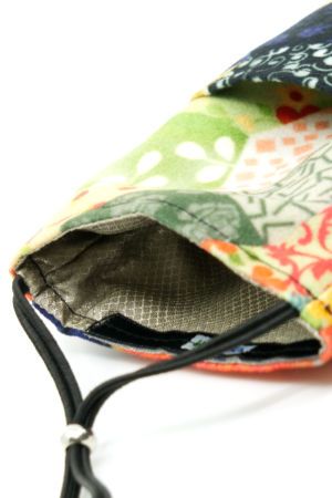Detail of the two integrated pockets and the integrated shielding fabric.